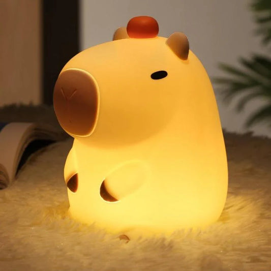 Capybara Cute Lamp, with an orange on his head.