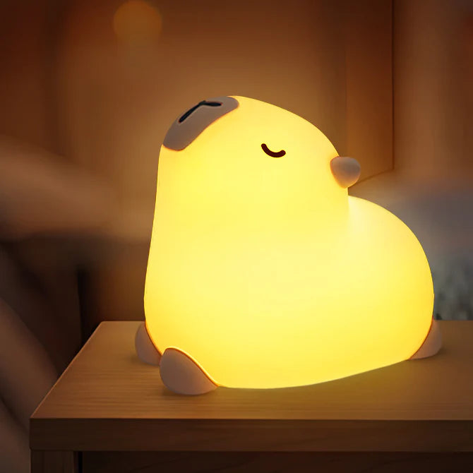 a silicone capybara lamp in yoga style