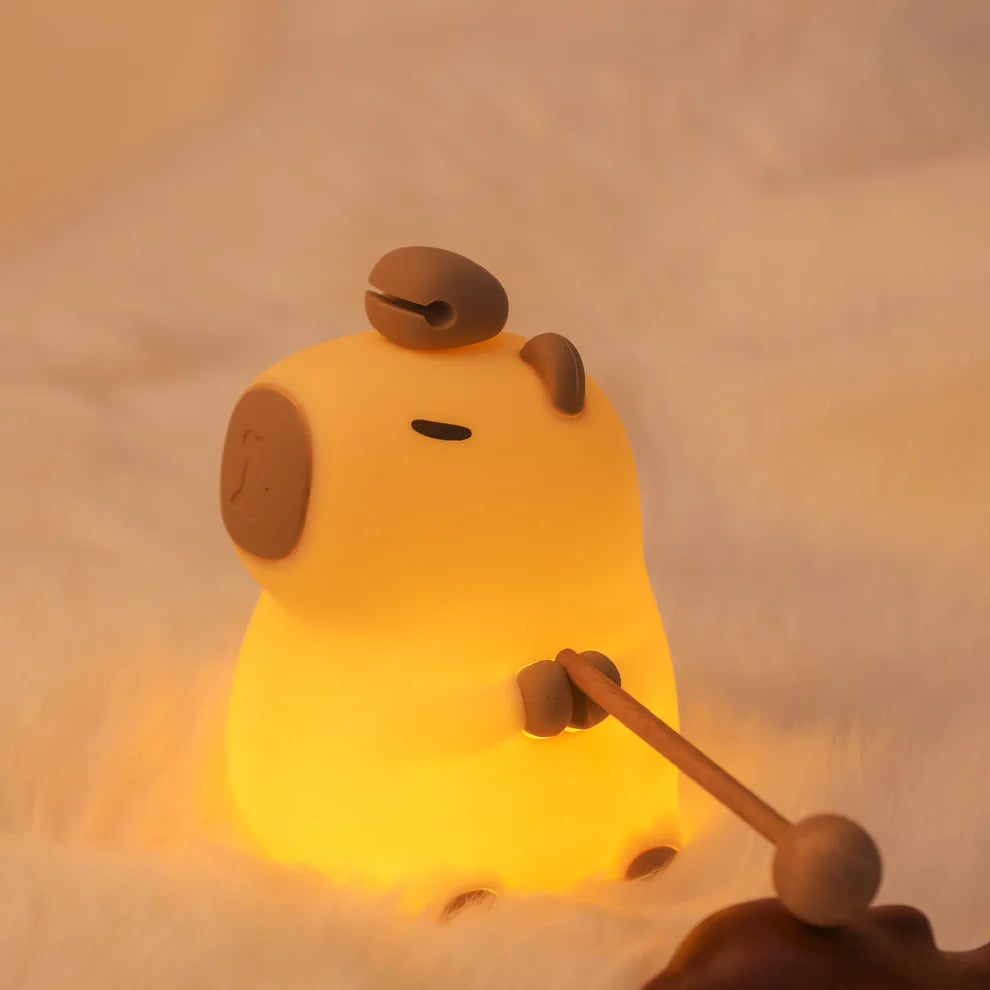 Cute animal-shaped capybara night light for cozy spaces, with a wood fish.